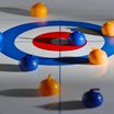 Spielsteine auf einem Curling-Spielfeld in Orange und Blau