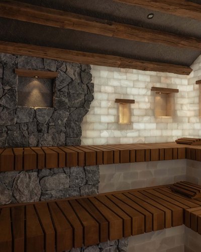 Innenraum einer Sauna mit Holzbänken und beleuchteten Steinwänden